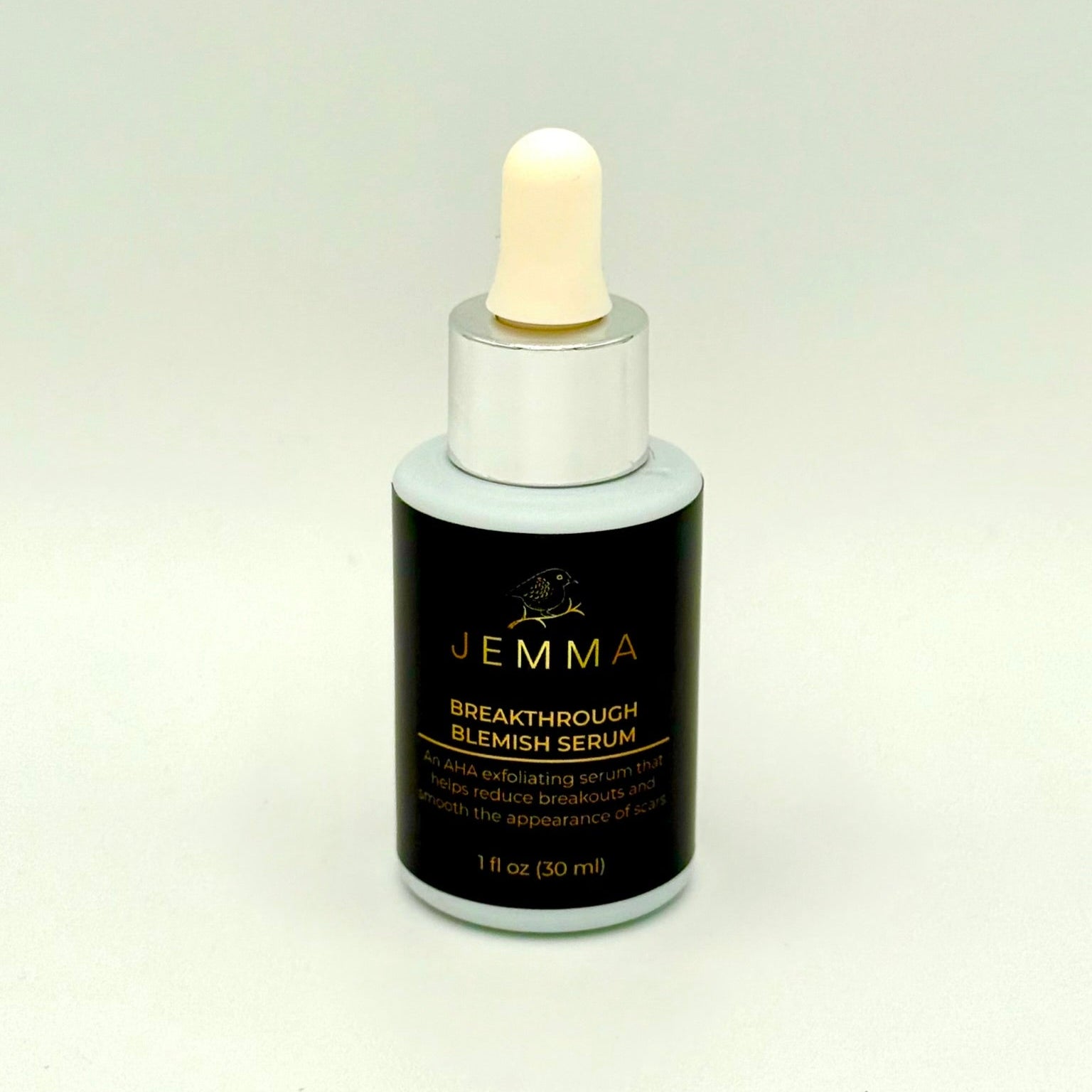 A bottle of the Breakthrough Blemish Serum solution.