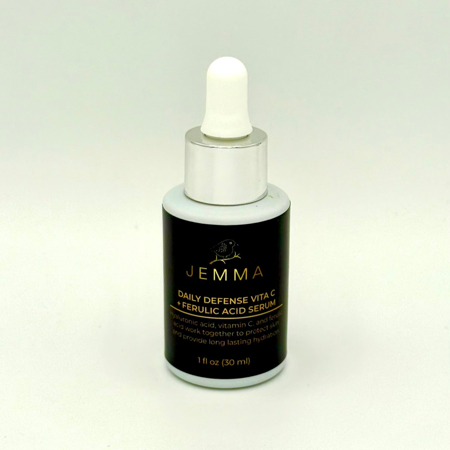 A bottle of Daily Defense Vita C + Ferulic Acid Serum.