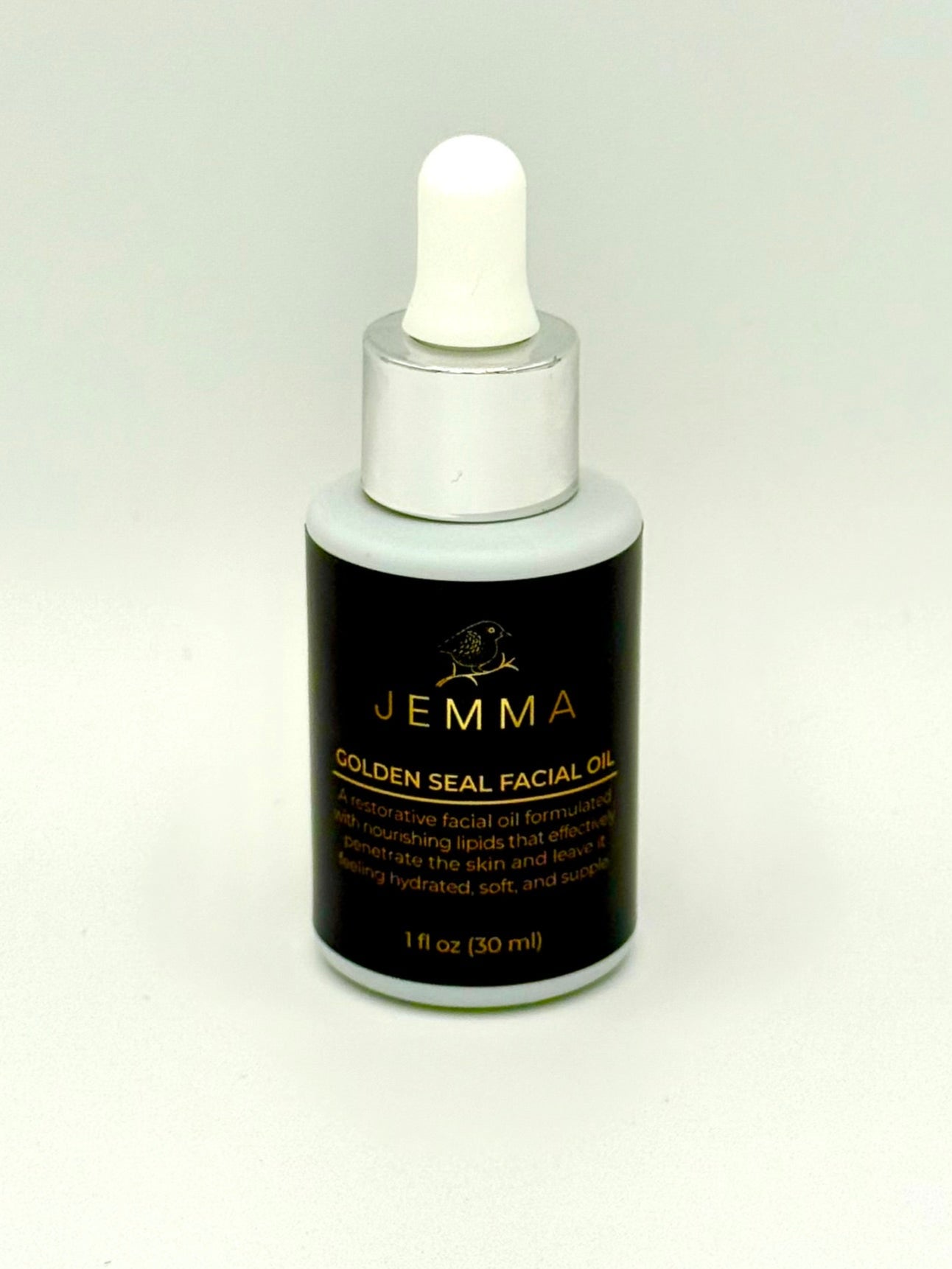 Bottle of Jemma Golden Seal Facial Oil on a white background